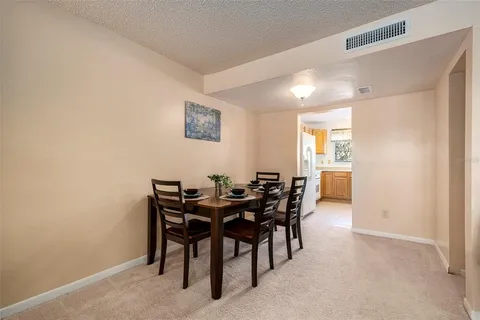 a kitchen with a table and chairs in it