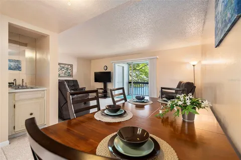 a view of kitchen with furniture and a window