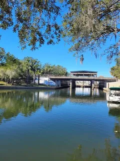 an aerial view of a house with a lake view