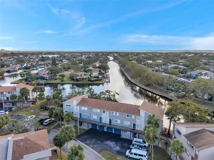 an aerial view of residential houses with city view