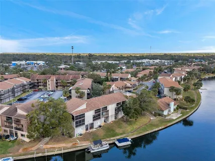 an aerial view of residential houses with city view