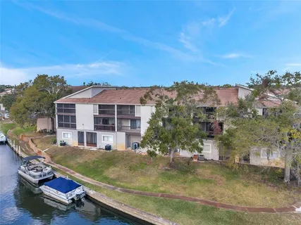 an aerial view of residential houses with city view