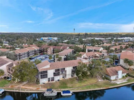 an aerial view of a house with a lake view