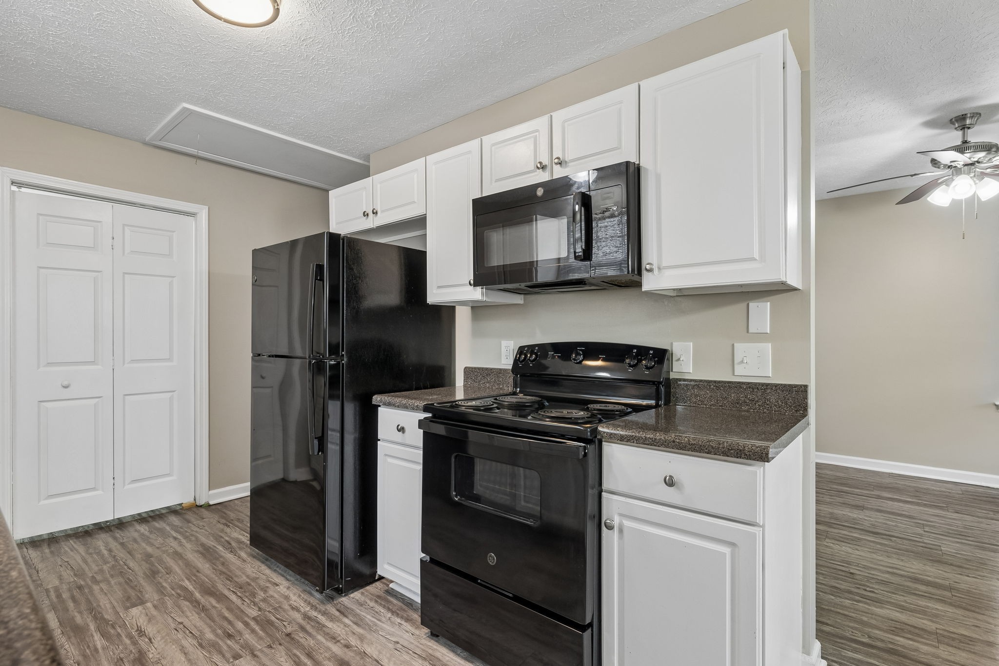 511 Hayes Street Springfield, TN 37172 - Photo 8 of 26 a kitchen with stainless steel appliances granite countertop a refrigerator stove and microwave
