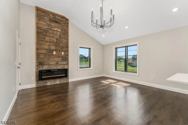 an empty room with windows and entrance