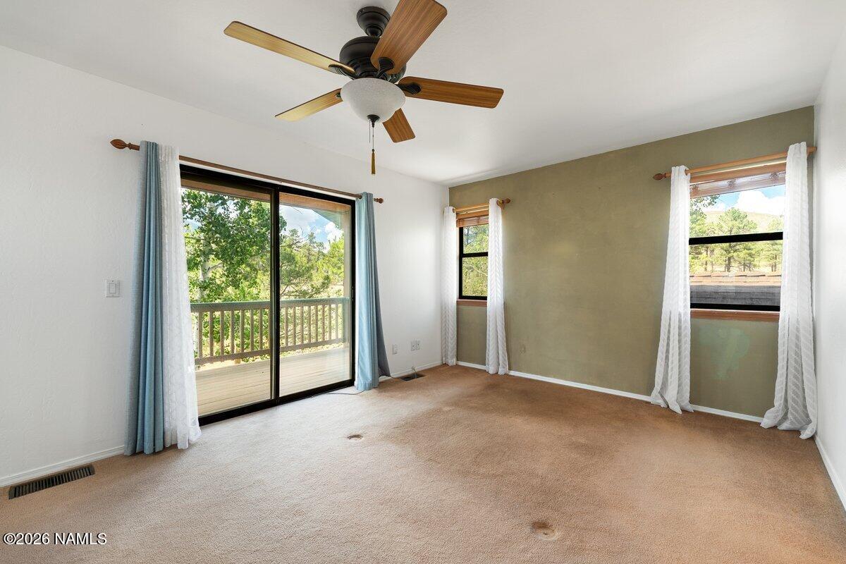 5535 East Western Star Road Flagstaff, AZ 86004 - Photo 21 of 49 a view of an empty room with a window