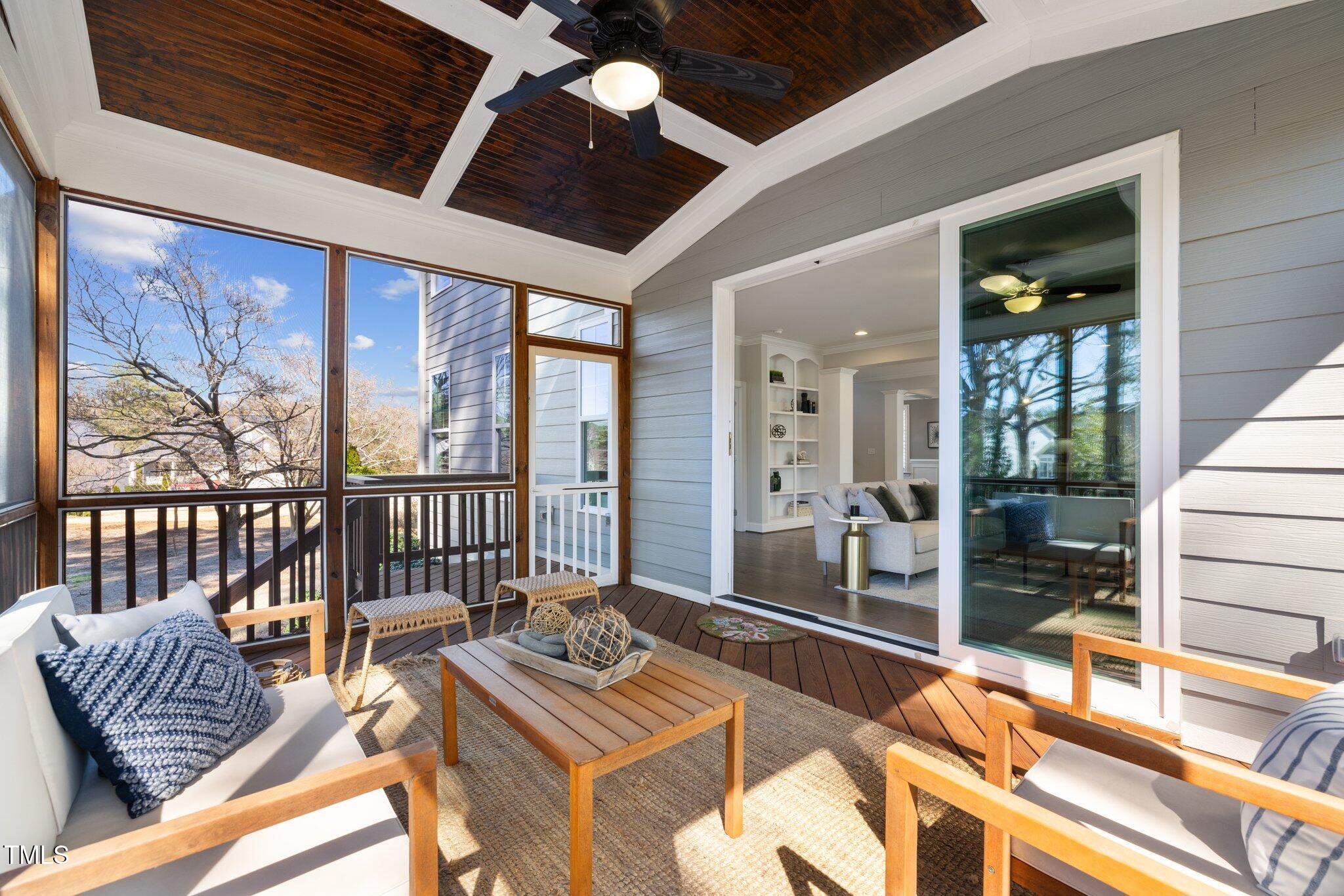 1013 Manchaca Loop Apex, NC 27539 - Photo 19 of 50 a living room with furniture and a floor to ceiling window
