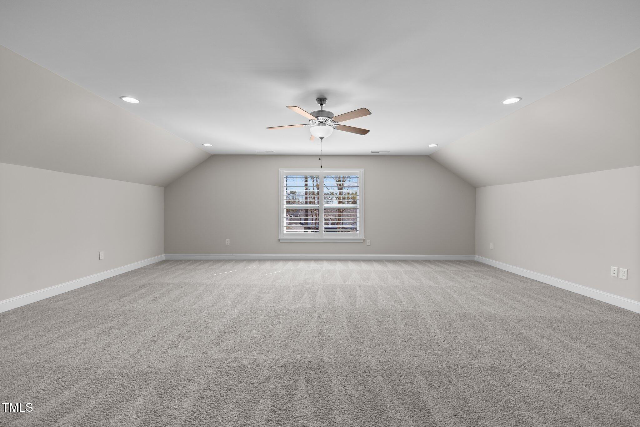 1013 Manchaca Loop Apex, NC 27539 - Photo 40 of 50 an empty room with fan and windows