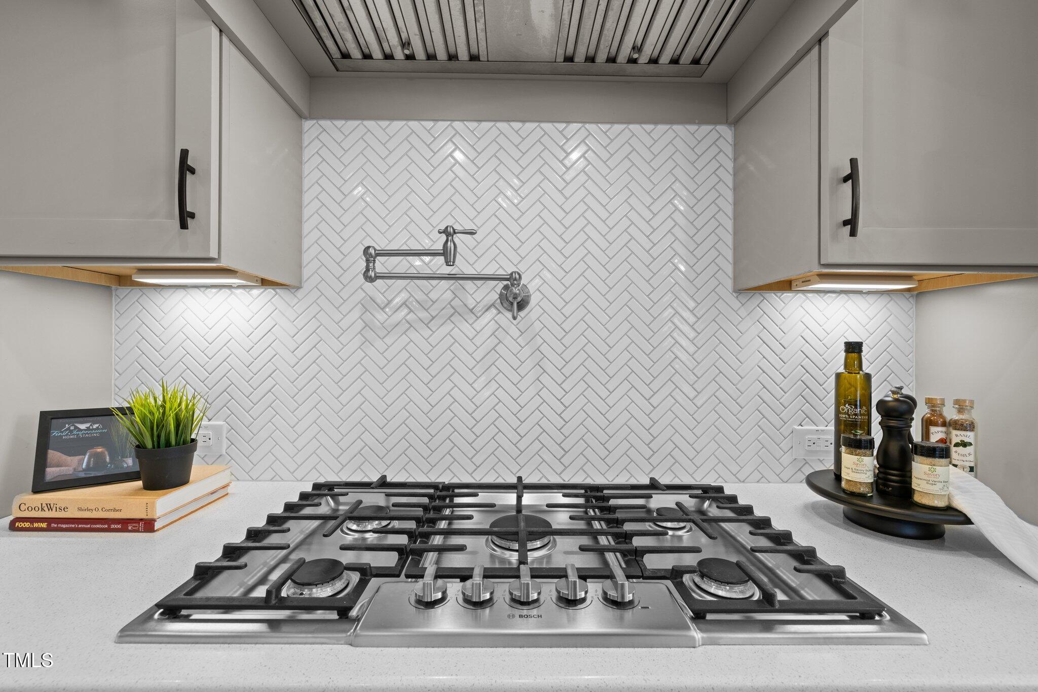 1013 Manchaca Loop Apex, NC 27539 - Photo 8 of 50 a white stove top oven sitting inside of a kitchen