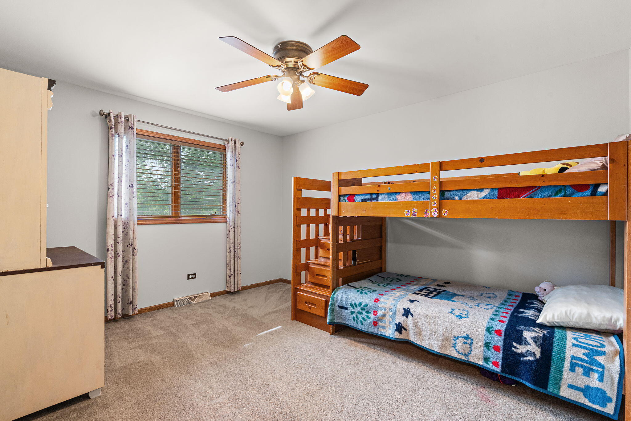 8987 Calhoun Place Crown Point, IN 46307 - Photo 15 of 28 a bedroom with a bed and a chandelier