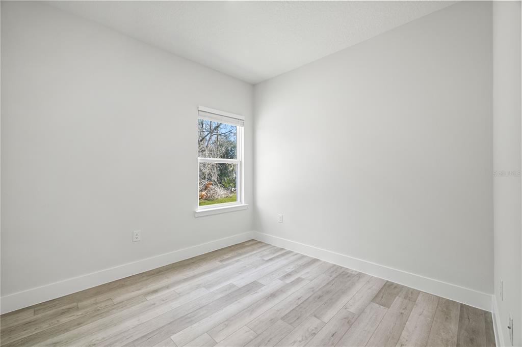 16054 Southwest 29th Court Road Ocala, FL 34473 - Photo 18 of 27 an empty room with a window