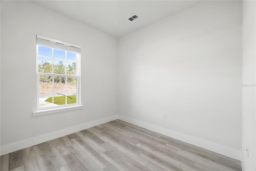 16054 Southwest 29th Court Road Ocala, FL 34473 - Photo 22 of 27 an empty room with a window