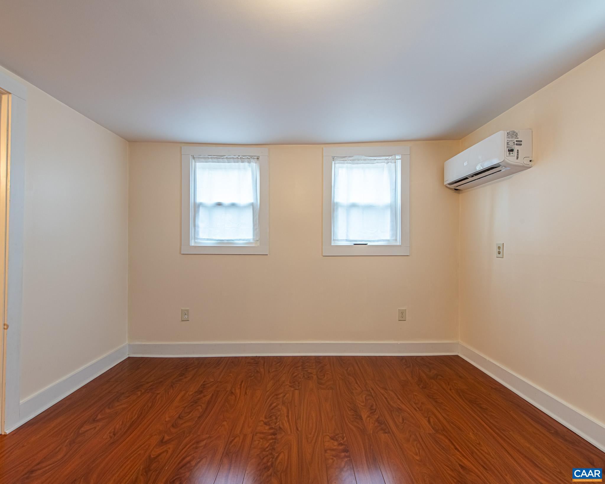 67 Lentz Lane Shipman, VA 22971 - Photo 14 of 31 an empty room with wooden floor and windows
