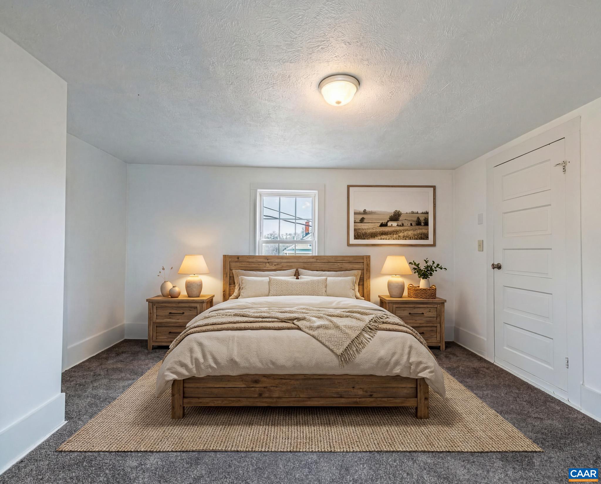 67 Lentz Lane Shipman, VA 22971 - Photo 16 of 31 a bedroom with a bed and wooden floor