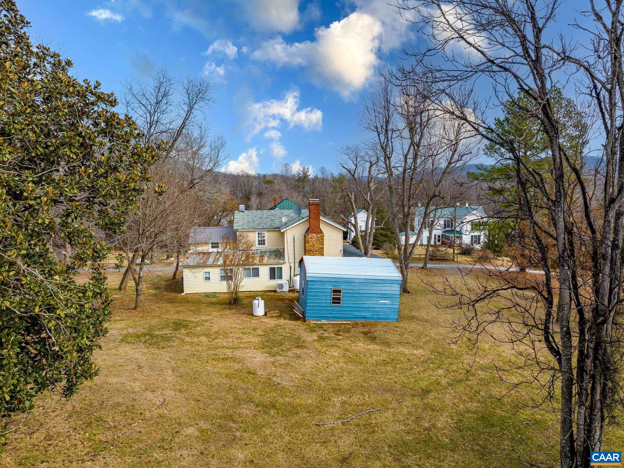 67 Lentz Lane Shipman, VA 22971 - Photo 25 of 31 a view of a yard with yellow house