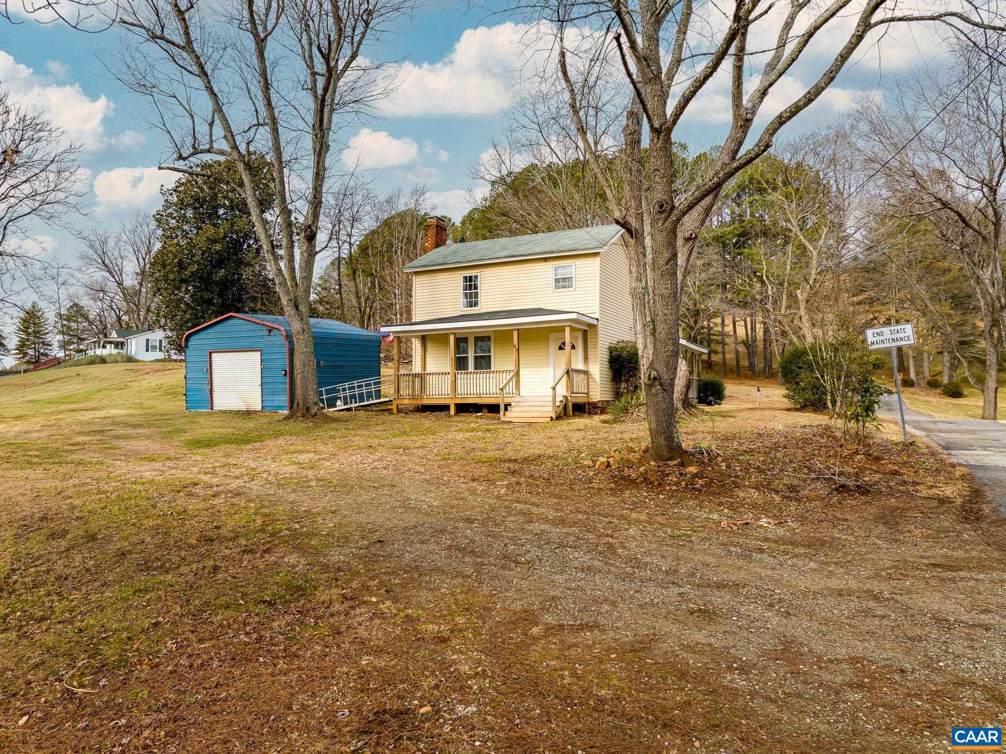 67 Lentz Lane Shipman, VA 22971 - Photo 26 of 31 a front view of a building with a yard