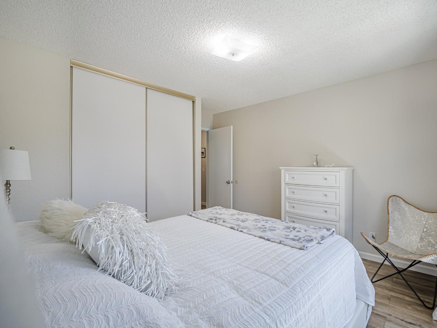 569 Cedar Drive Watsonville, CA 95076 - Photo 19 of 30 a bedroom with a bed a table and chair
