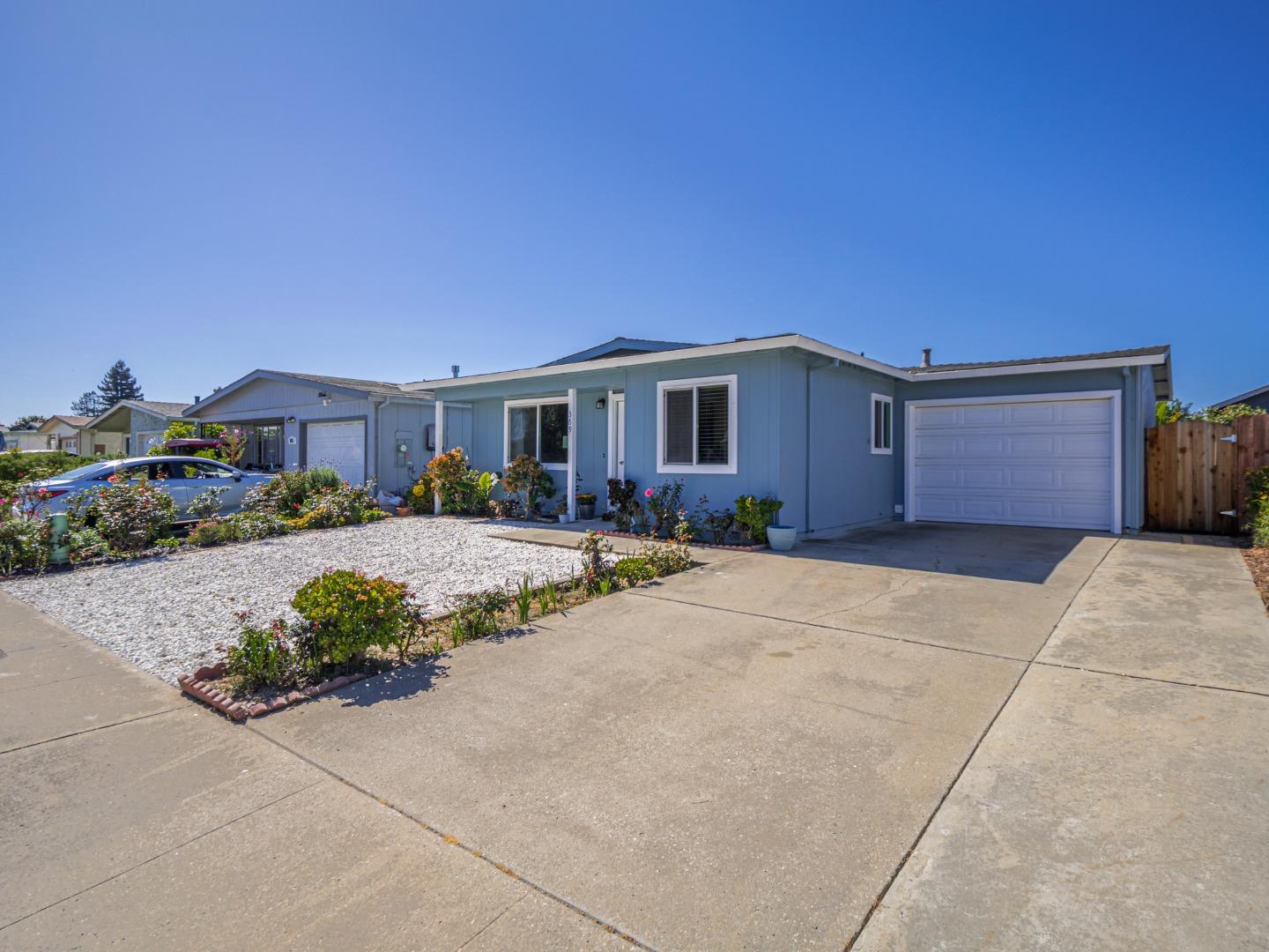 569 Cedar Drive Watsonville, CA 95076 - Photo 3 of 30 a front view of a house with a yard and outdoor seating