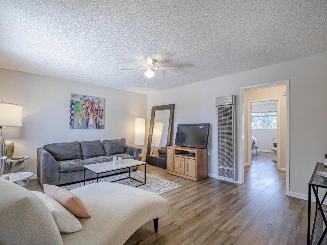 569 Cedar Drive Watsonville, CA 95076 - Photo 4 of 30 a living room with furniture ceiling fan and a wooden floor