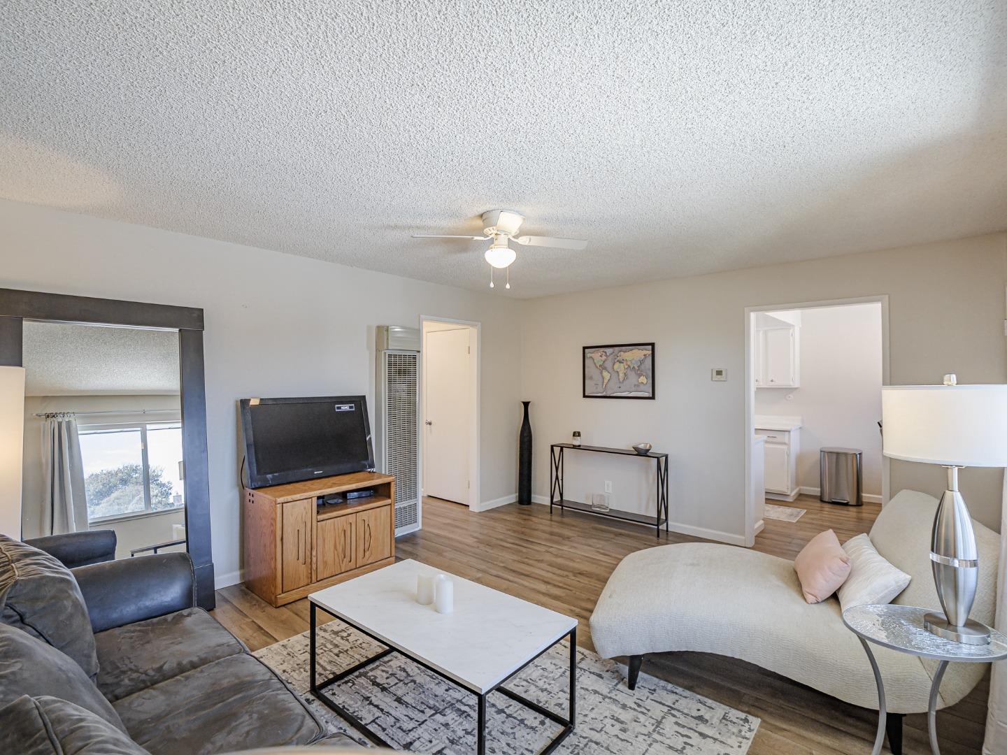 569 Cedar Drive Watsonville, CA 95076 - Photo 6 of 30 a living room with furniture and a flat screen tv