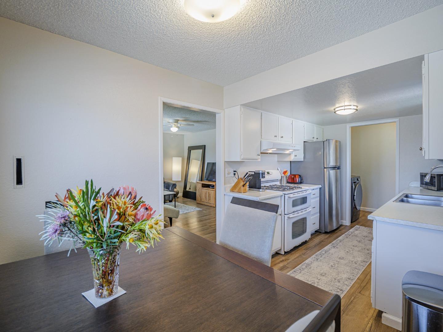 569 Cedar Drive Watsonville, CA 95076 - Photo 8 of 30 a living room with kitchen island furniture and a potted plant