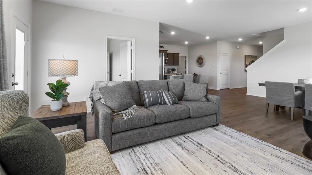 636 Dunham Road Nevada, TX 75173 - Photo 24 of 31 Open-concept living area featuring wood-finish flooring and recessed lighting