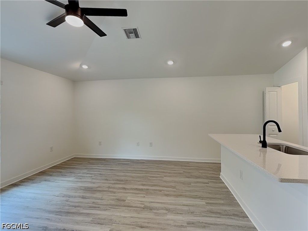 3201 23rd Street Southwest Lehigh Acres, FL 33976 - Photo 4 of 15 a view of a room with a sink and dishwasher