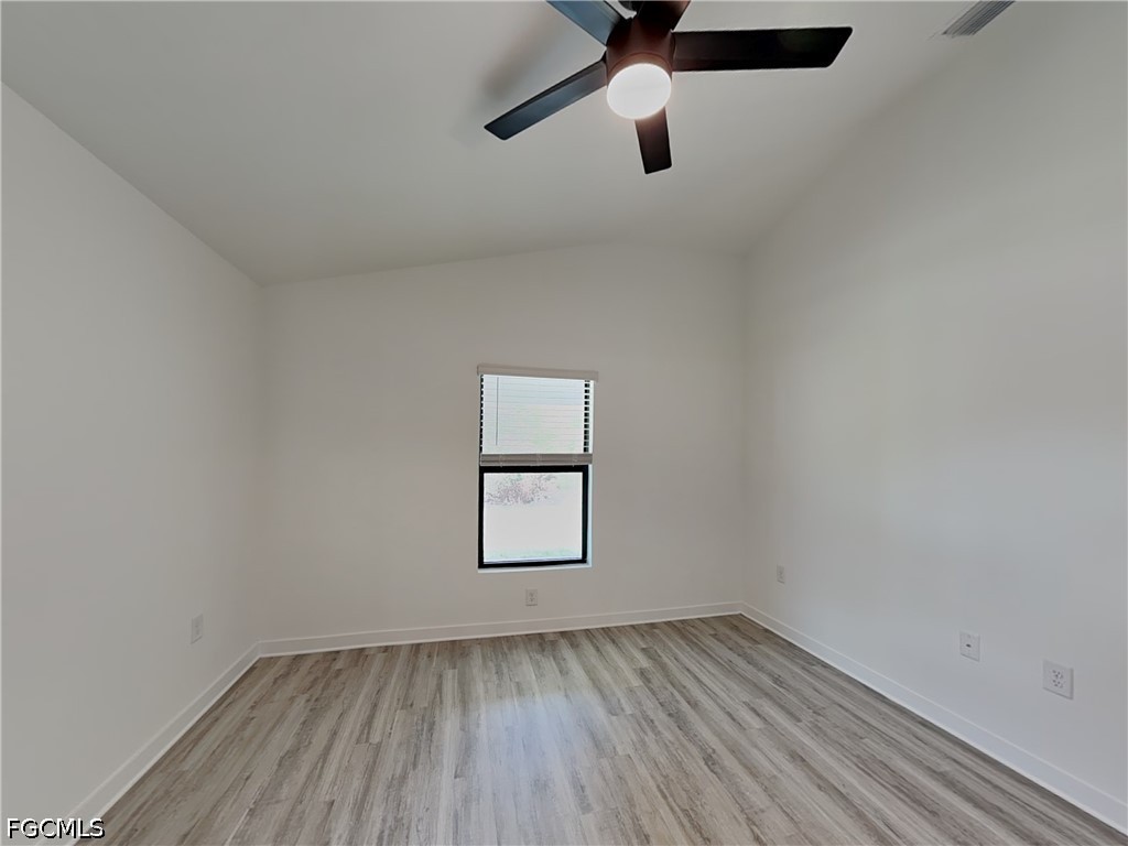 3201 23rd Street Southwest Lehigh Acres, FL 33976 - Photo 6 of 15 an empty room with a window