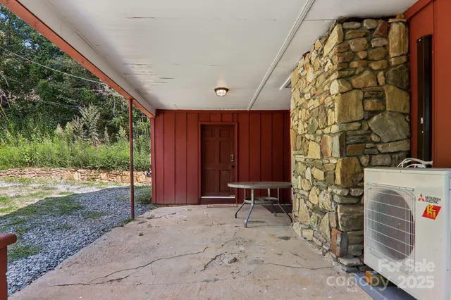 a view of backyard with tub and trees