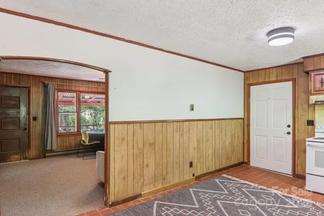 a view of a room with wooden floor and windows