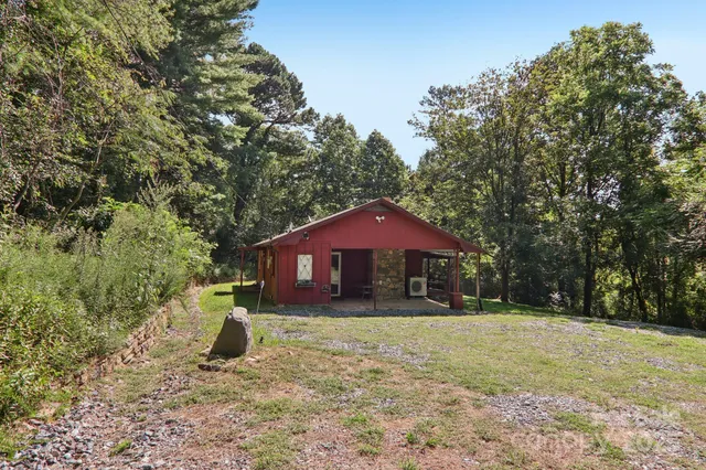 a kitchen with a refrigerator a table and chairs