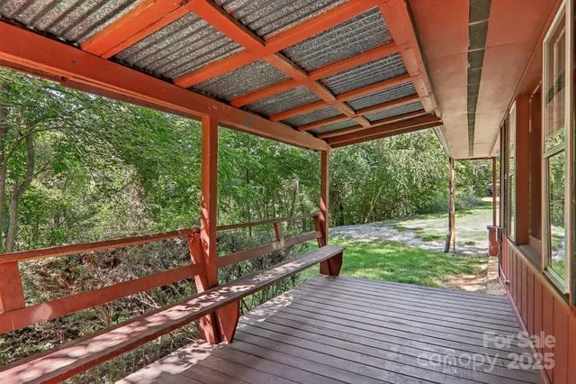 a view of a porch with wooden floor and outdoor space