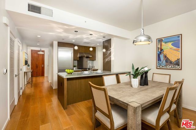 a view of a room with wooden floor and bathroom