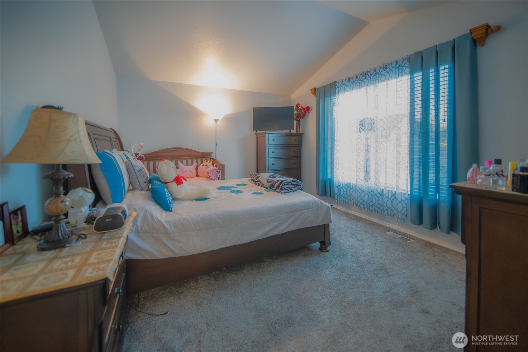 5615 South 233rd Street Kent, WA 98032 - Photo 16 of 24 a bedroom with a bed and a lamp