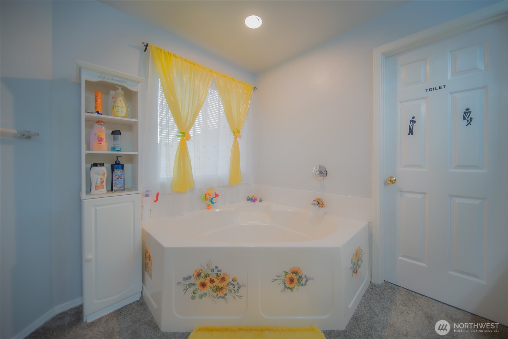 5615 South 233rd Street Kent, WA 98032 - Photo 18 of 24 a bathroom with a sink and a bathtub