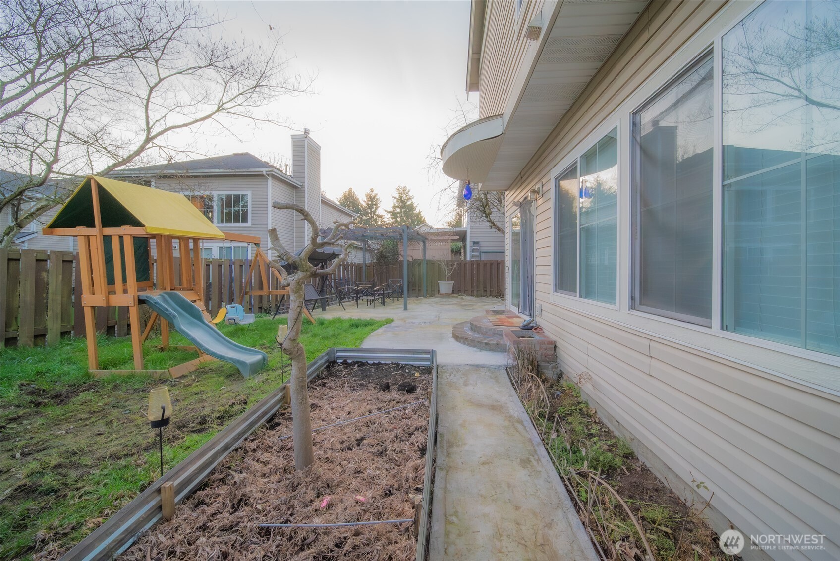 5615 South 233rd Street Kent, WA 98032 - Photo 21 of 24 a view of a house with a yard