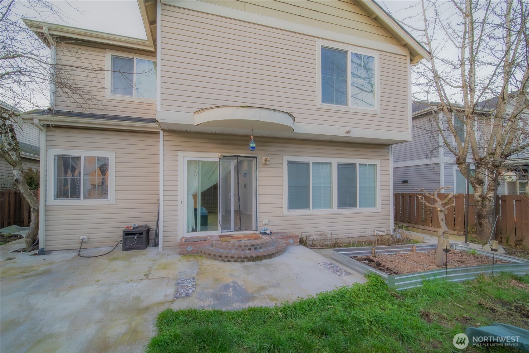 5615 South 233rd Street Kent, WA 98032 - Photo 22 of 24 a front view of a house with a yard