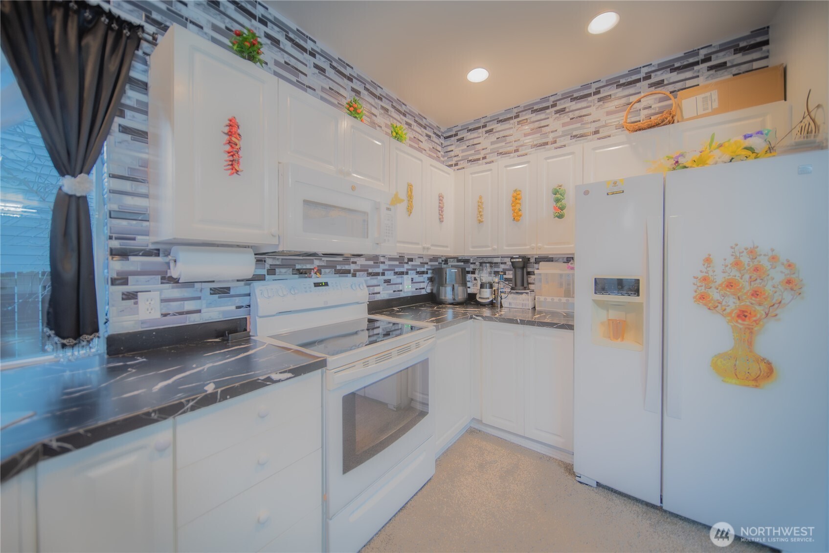 5615 South 233rd Street Kent, WA 98032 - Photo 7 of 24 a kitchen with stainless steel appliances granite countertop a white stove top oven a sink and dishwasher