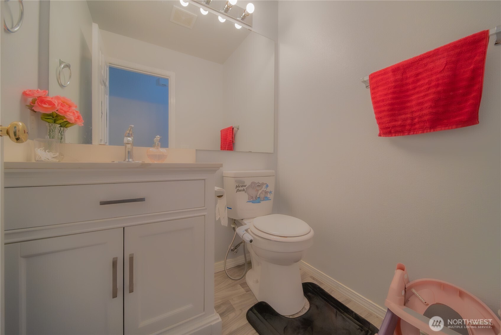 5615 South 233rd Street Kent, WA 98032 - Photo 10 of 24 a bathroom with a sink vanity and toilet