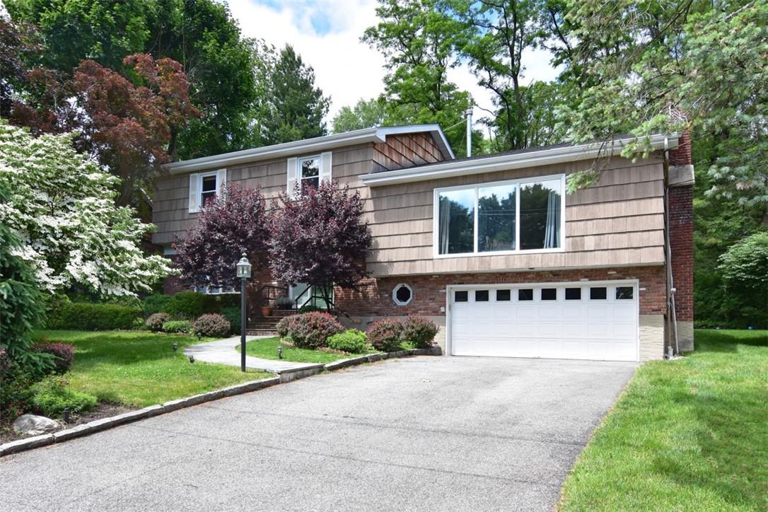 a house that has a tree in front of the house