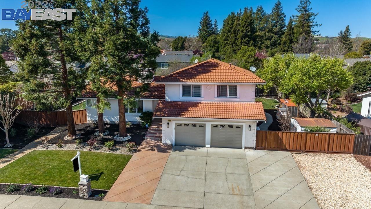 3772 Norris Canyon Road San Ramon, CA 94583 - Photo 1 of 1 a front view of a house with a garden and trees