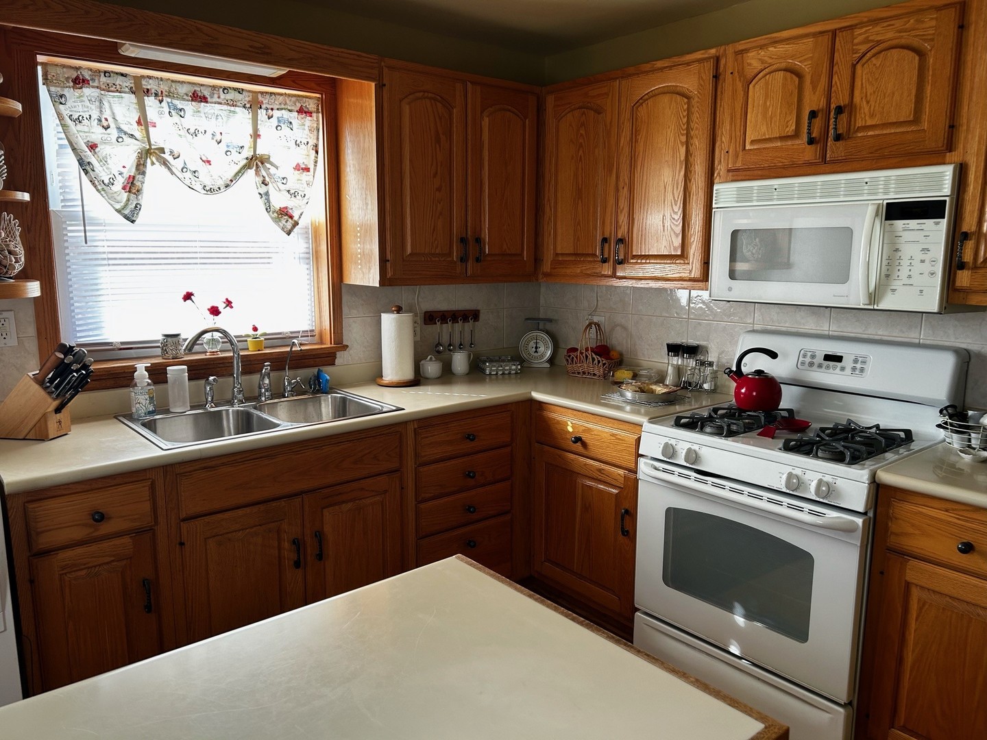 2247 South 15th Avenue North Riverside, IL 60546 - Photo 6 of 18 a kitchen with stainless steel appliances granite countertop a stove sink and cabinets