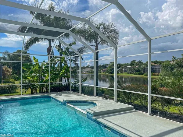 a view of a chair and table in the garden