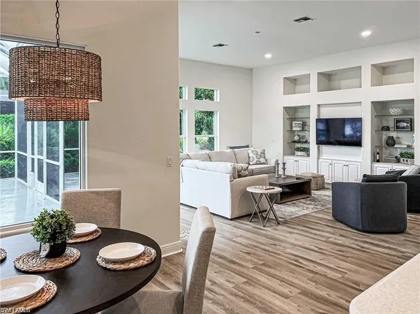 a living room with furniture and a table
