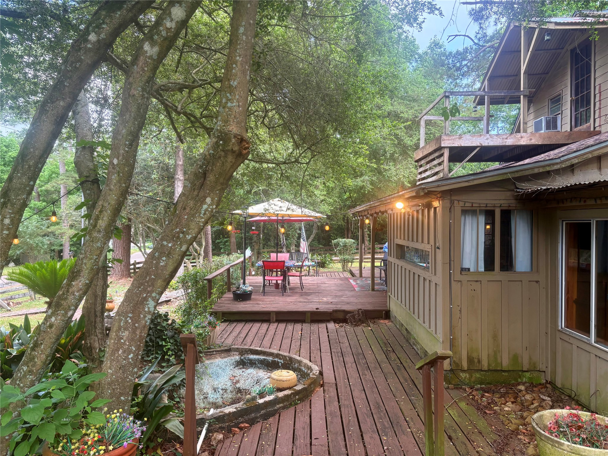 12505 Rollingwood Loop Conroe, TX 77303 - Photo 4 of 24 a view of outdoor space yard deck patio and outdoor seating