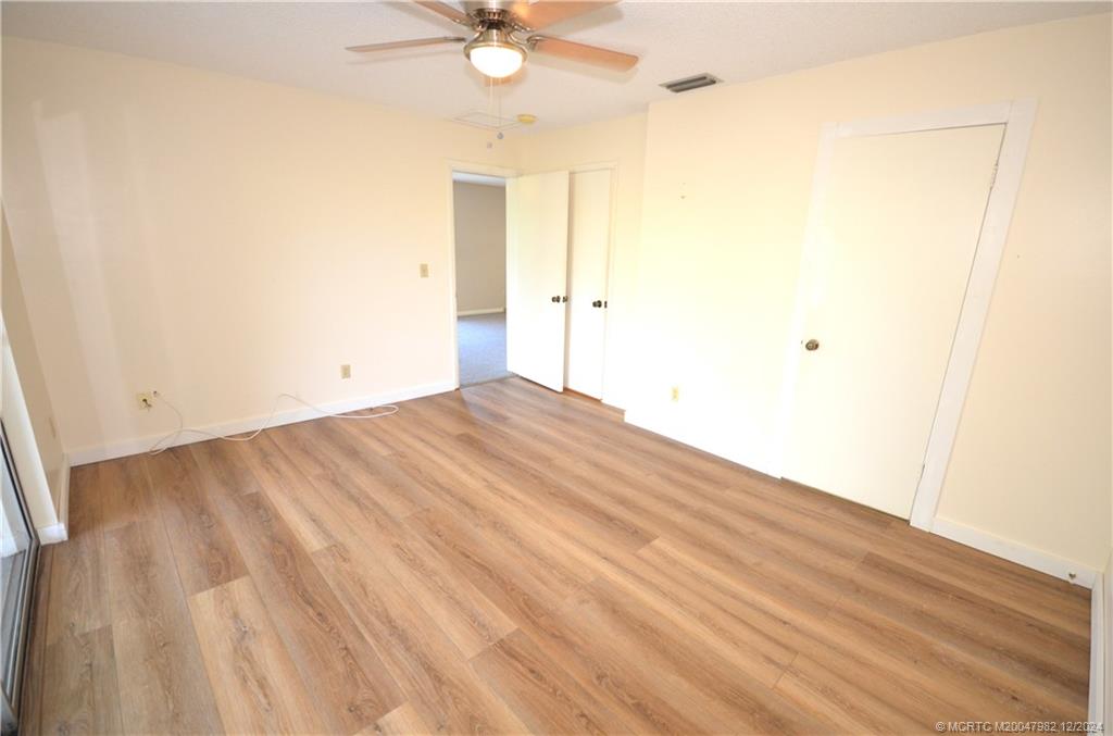 1900 South Kanner Highway, Unit 7205 Stuart, FL 34994 - Photo 14 of 25 a view of a room with wooden floor