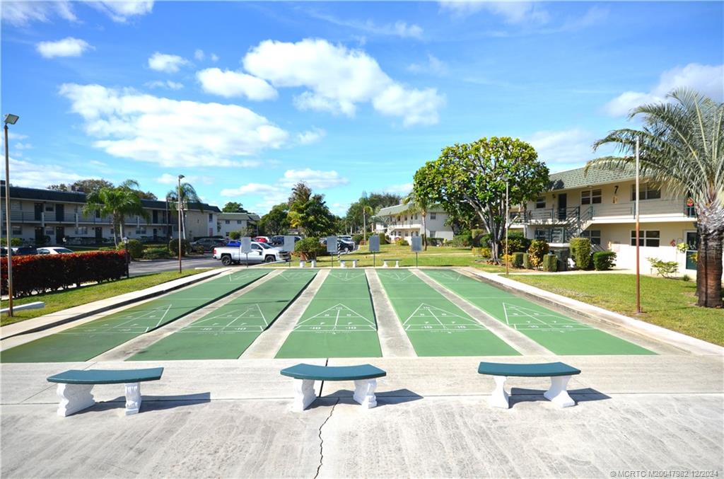 1900 South Kanner Highway, Unit 7205 Stuart, FL 34994 - Photo 20 of 25 a view of backyard with swimming pool and seating