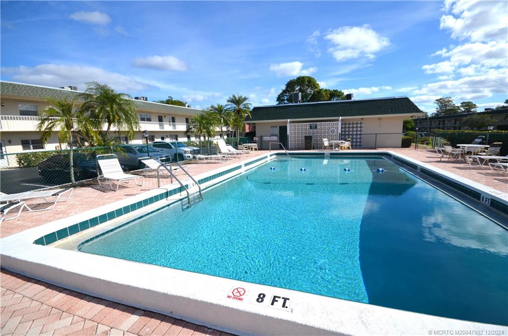 1900 South Kanner Highway, Unit 7205 Stuart, FL 34994 - Photo 2 of 25 a view of swimming pool with outdoor seating