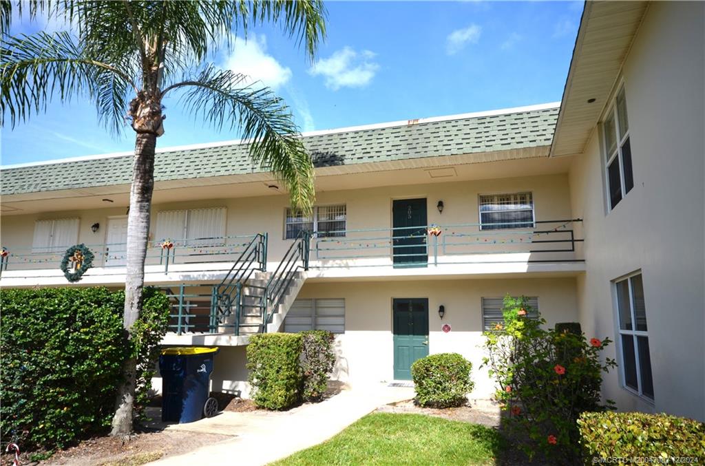 1900 South Kanner Highway, Unit 7205 Stuart, FL 34994 - Photo 21 of 25 a front view of a house with tree s