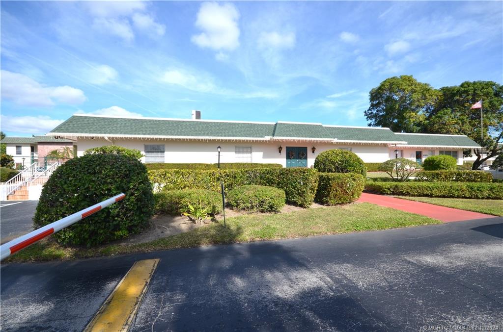 1900 South Kanner Highway, Unit 7205 Stuart, FL 34994 - Photo 24 of 25 a view of a garden with a building in the background
